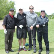 Four employees on the golf course at the Dufferin Concrete Golf Fundraiser Tournament